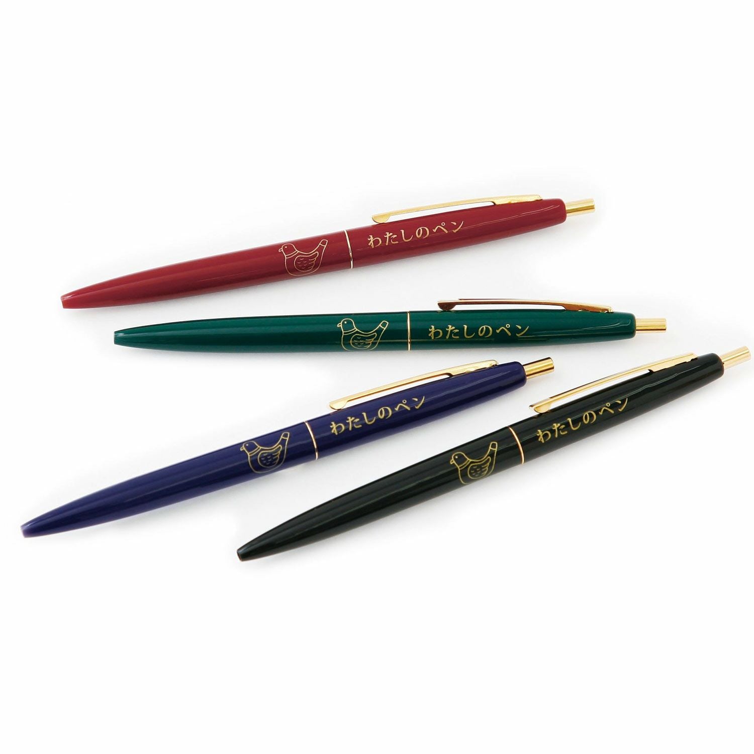 Four ballpoint pens in red, green, blue and black fanned out, each with pigeon design.