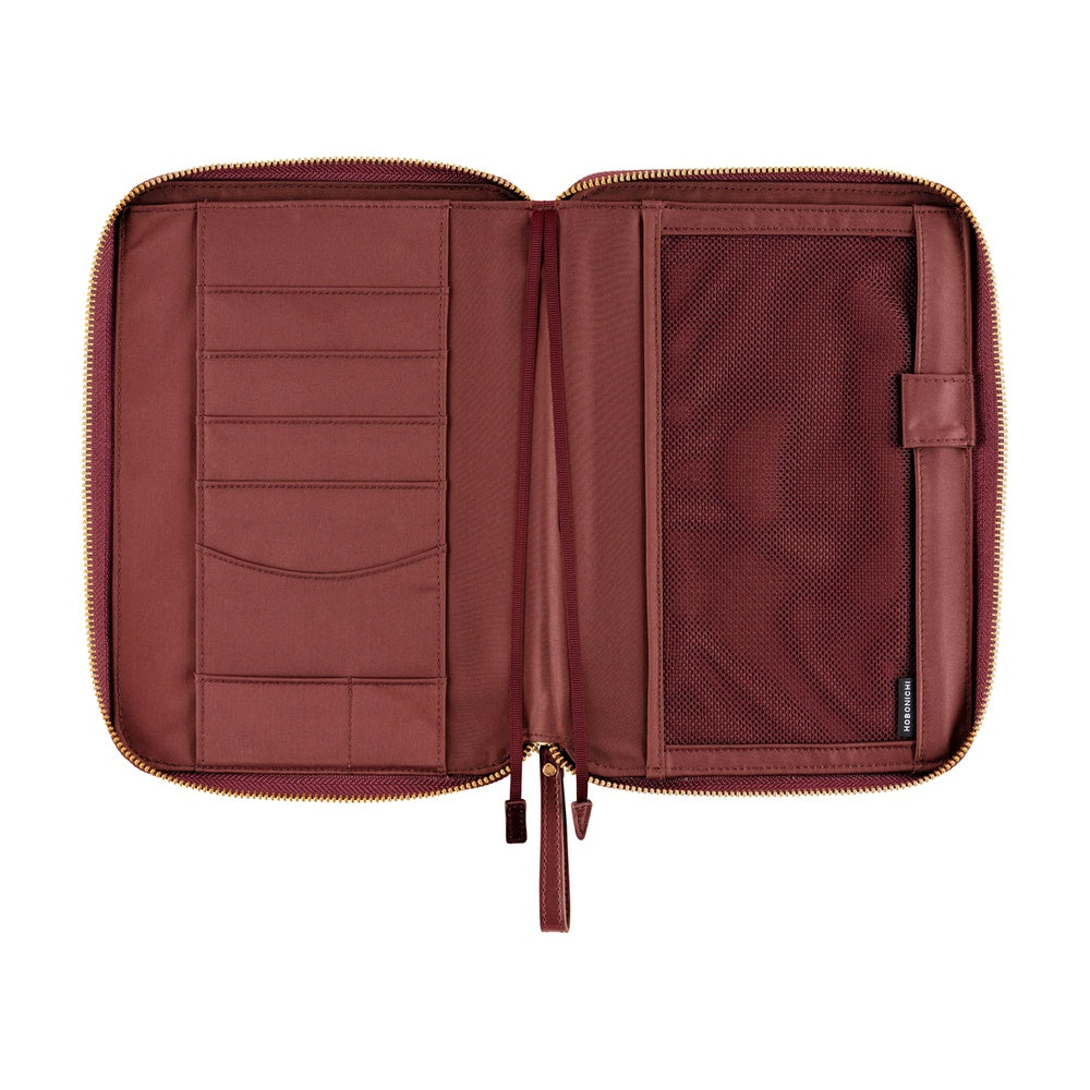 Open Amarone zip planner cover showing card slots, flat pockets and a gold zipper around the edge.