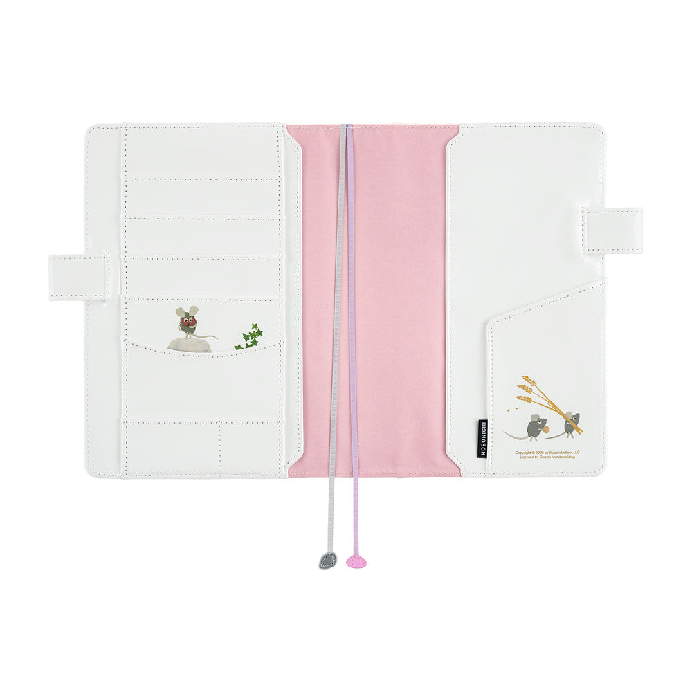 White Hobonichi A5 Cousin cover opened flat, showing card slots, mouse illustrations, pink panel and two bookmarks.