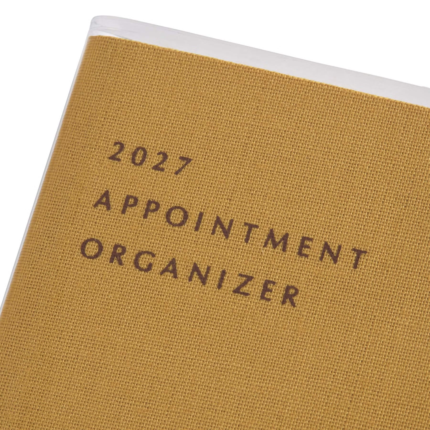 Close-up of the Yellow fabric cover with "2027 Appointment Organizer" printed under a clear protective jacket.
