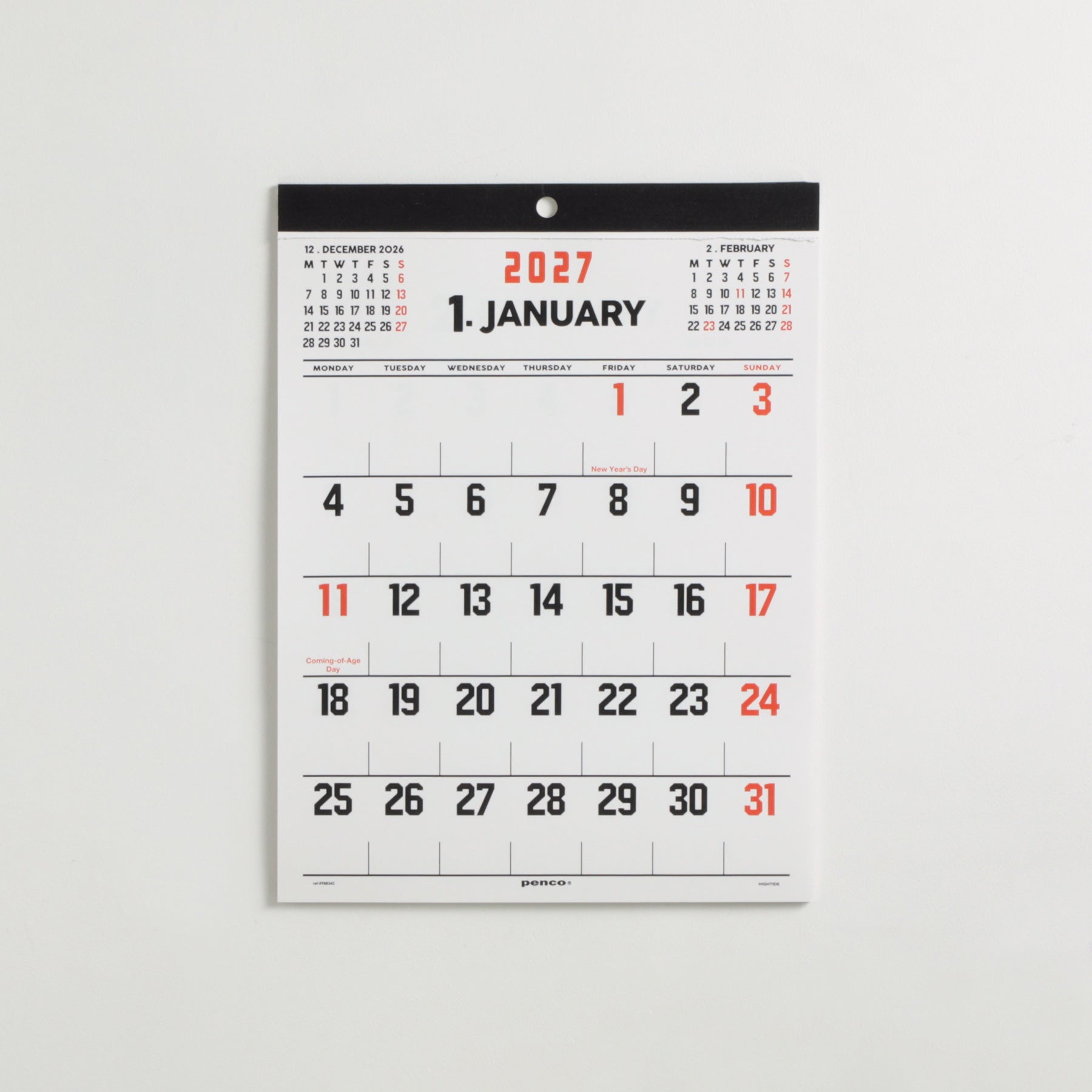 Penco 2027 A4 wall calendar hanging on a wall, open to January with bold black and red numbers.