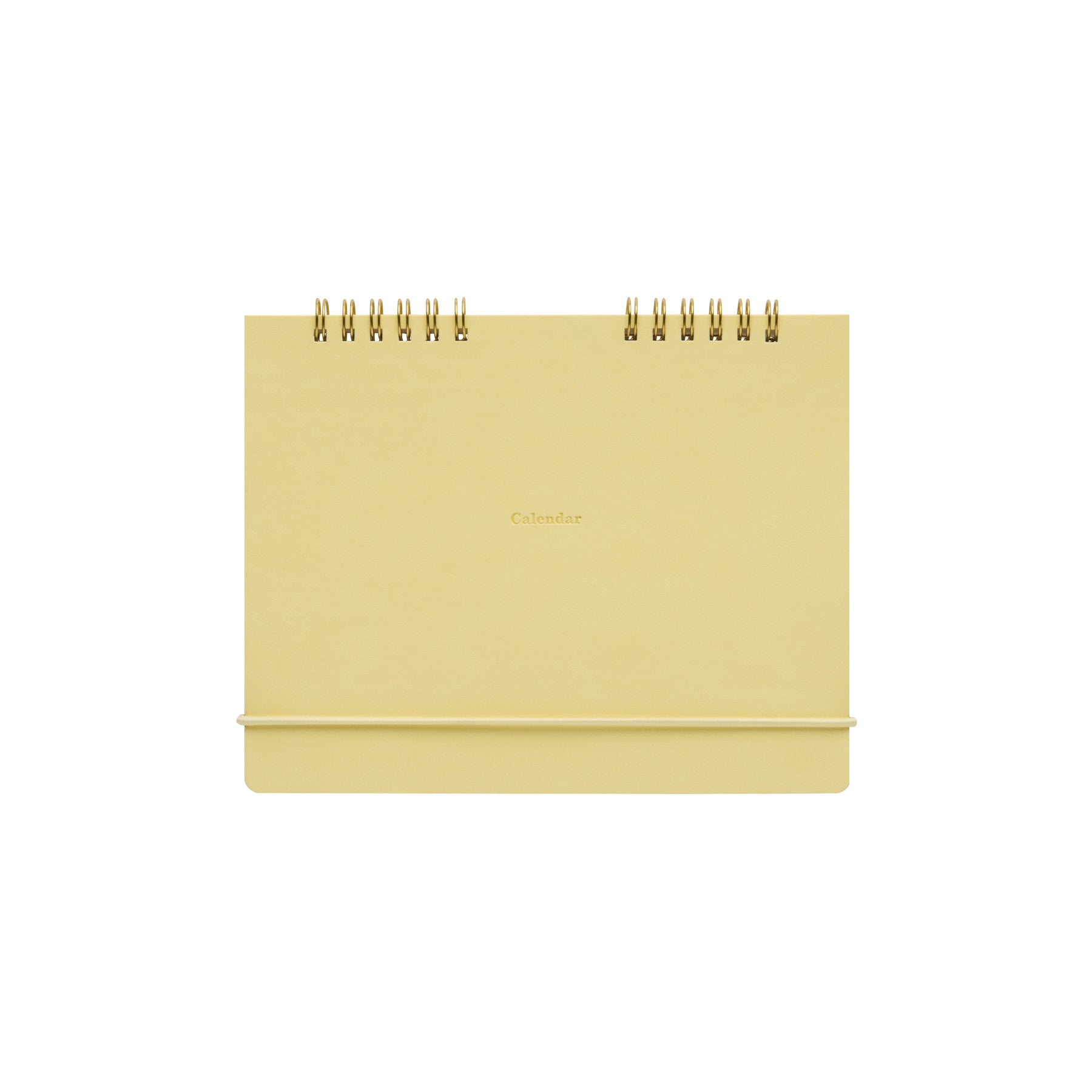 Light Yellow twin-ring desk calendar standing upright with gold "Calendar" lettering on the cover.