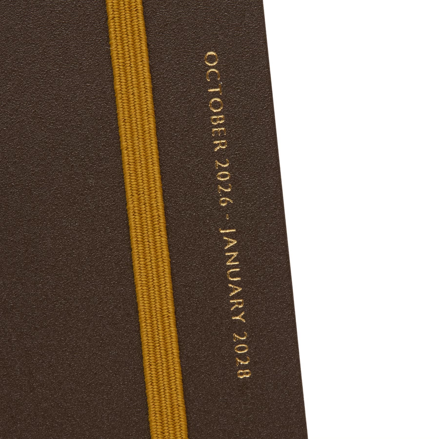 Close-up of the Brown planner cover with yellow elastic band and gold October 2026 – January 2028 text.