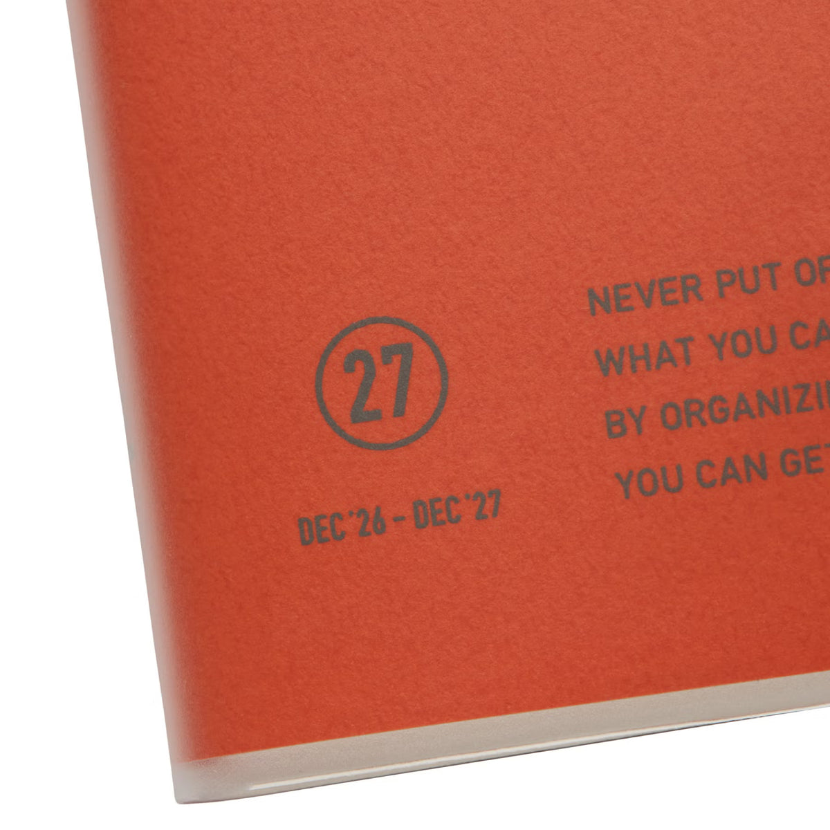 Close-up of the Red planner cover showing a circled 27, the dates Dec '26 – Dec '27, and printed text.