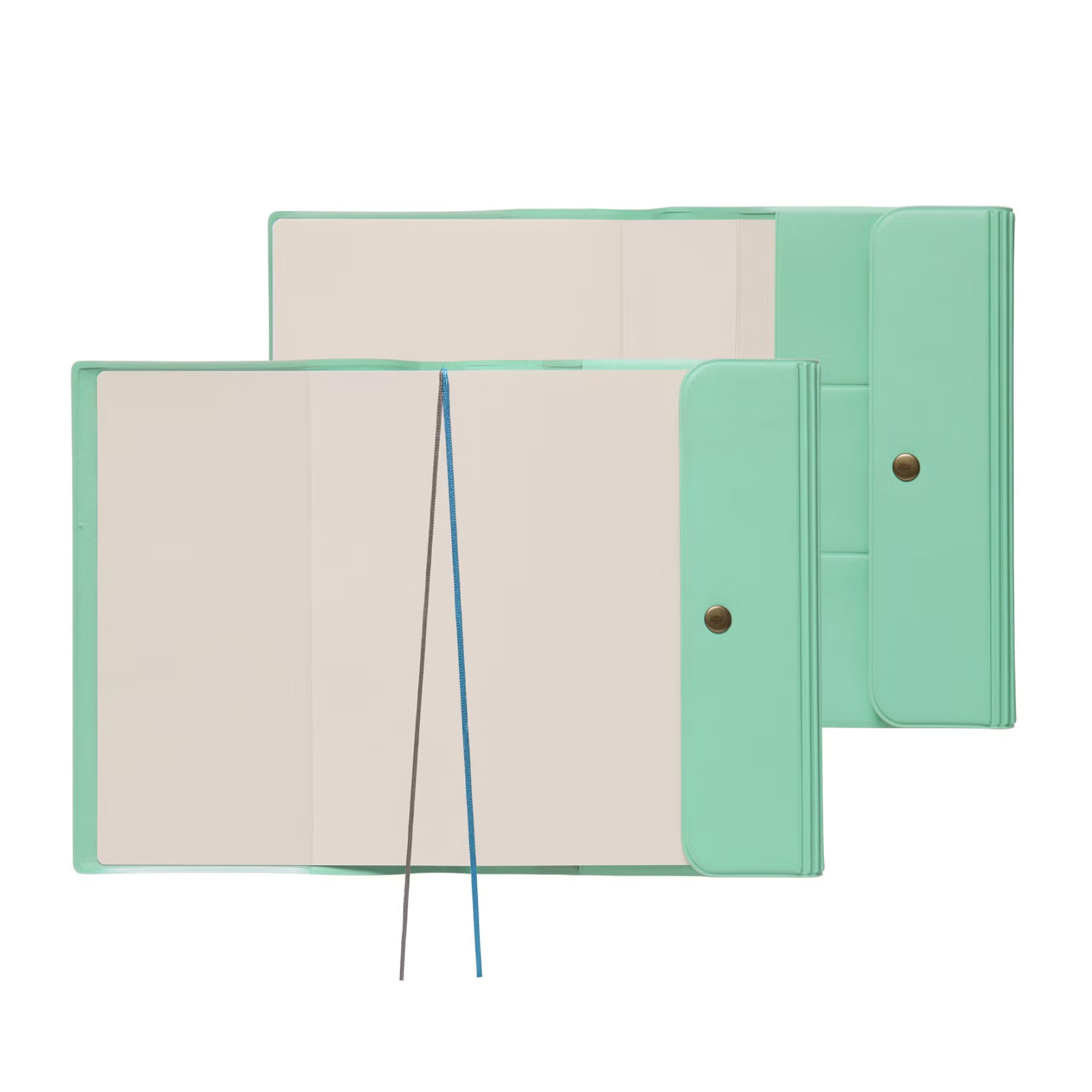 Two Mint Nähe B6 planners lying open, showing blank pages, two ribbon markers and snap-button flaps.