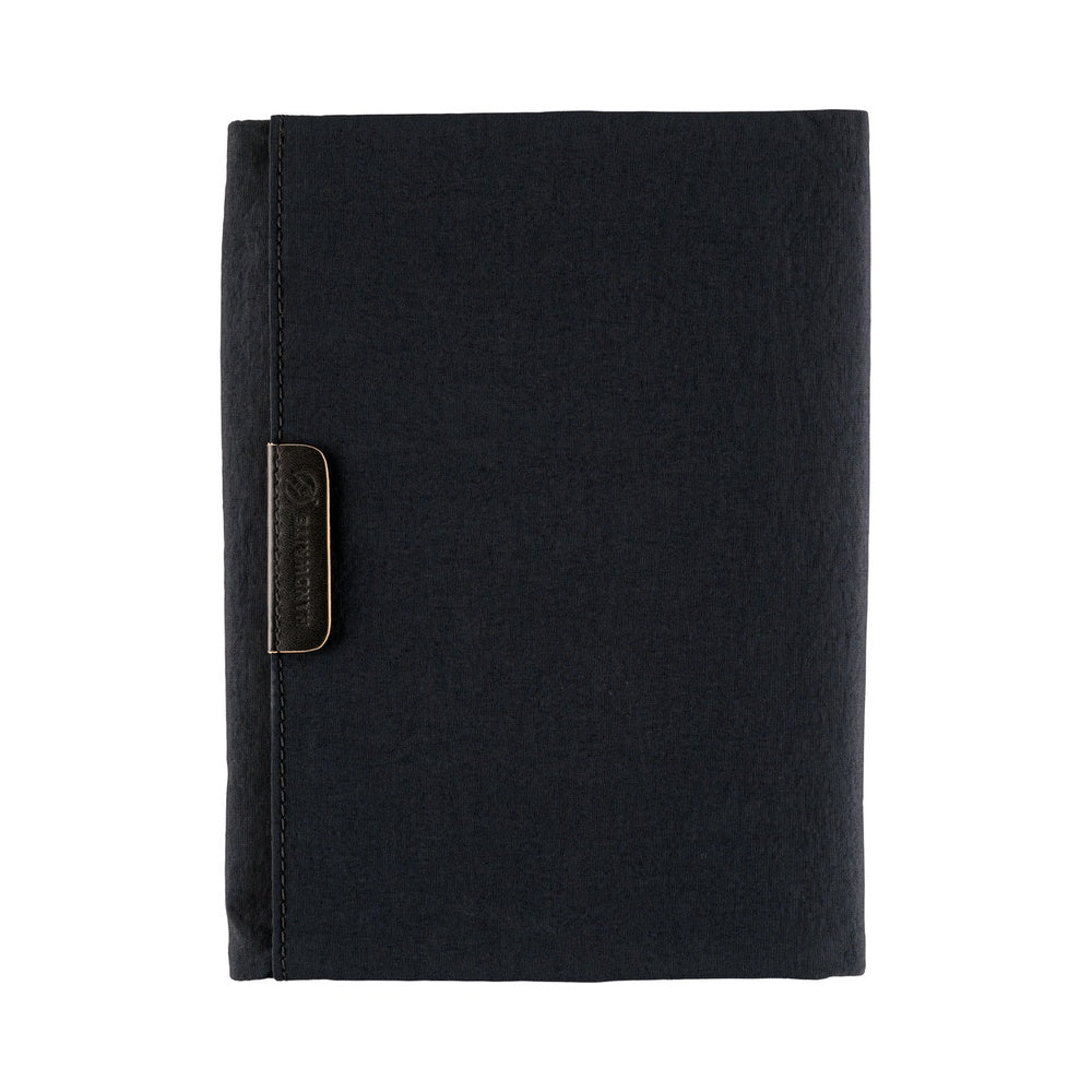 Hobonichi A6 Tragen book cover in Black fabric, closed flat with a small dark label tab on the front.