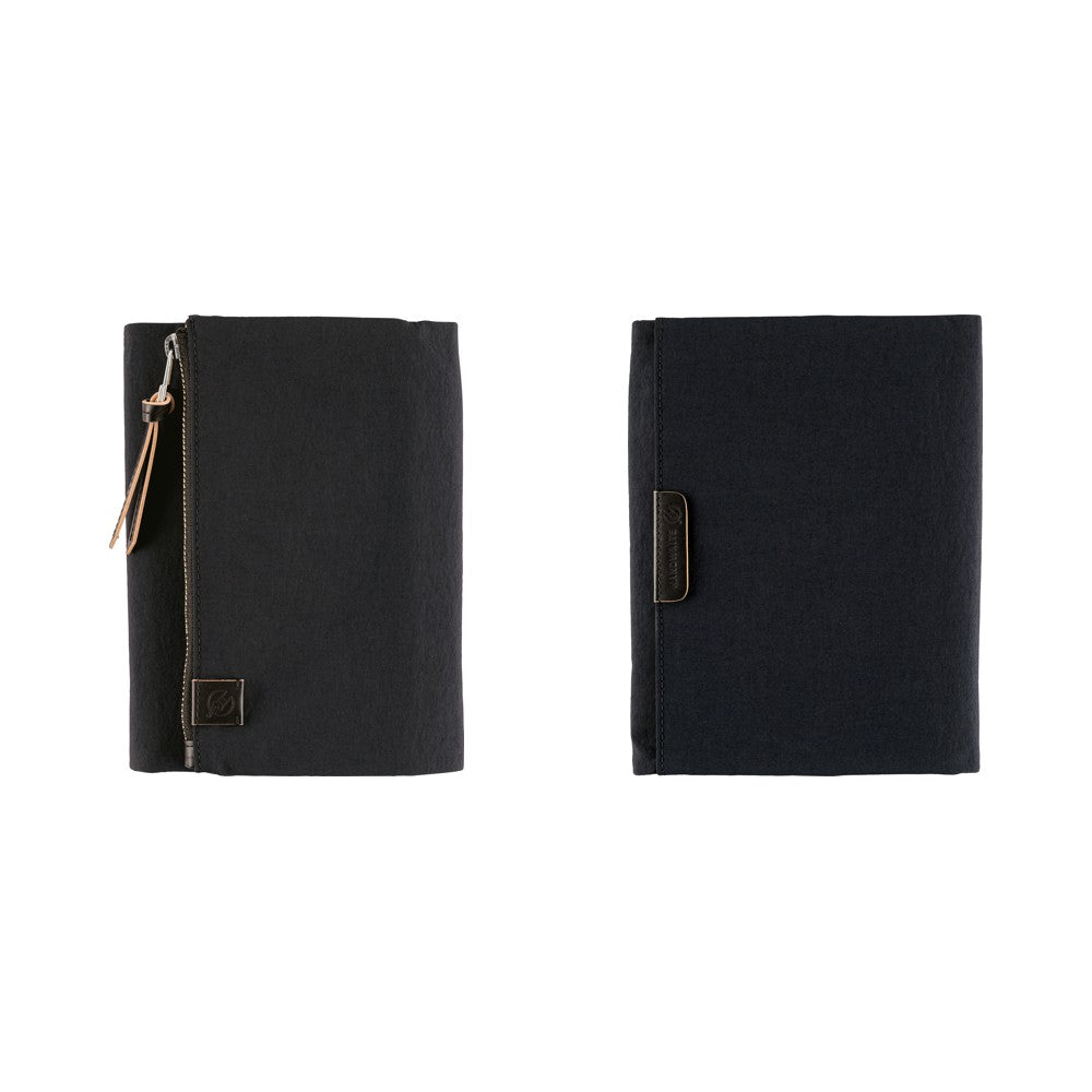 Black Hobonichi A6 book cover shown front and back, with zippered pocket, leather pull tab and logo tag.