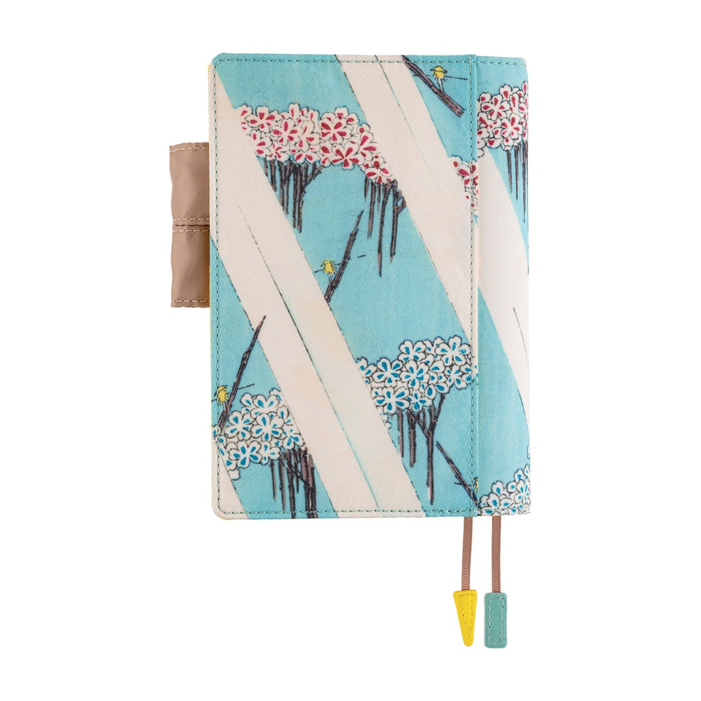 A6 planner cover with cherry blossom trees on pale blue, pen loop and two bookmark markers.