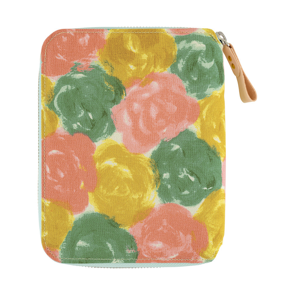 Zip-around A6 planner cover in painted floral print of pink, yellow and green with leather zipper pull.