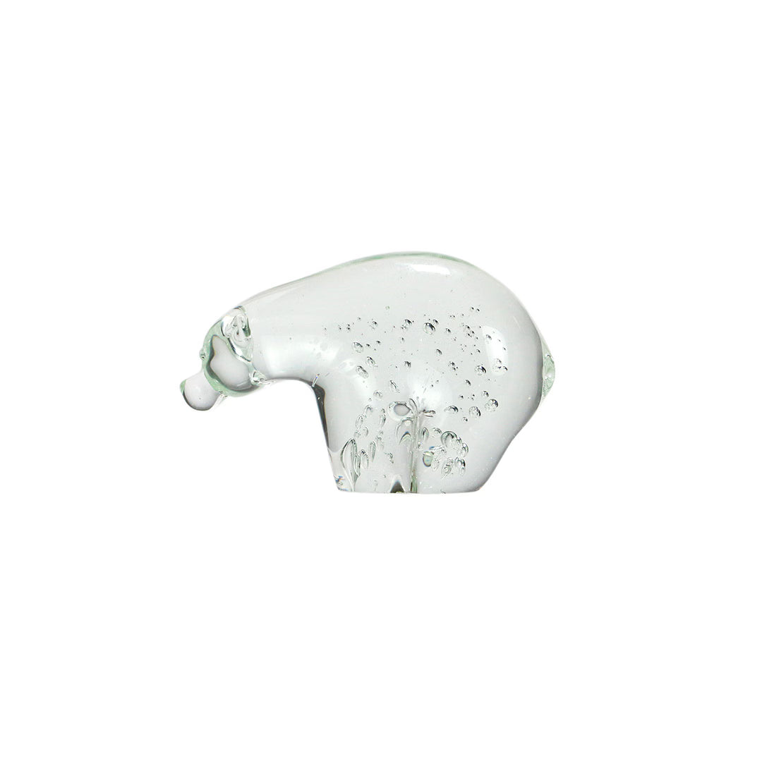 Clear glass polar bear figurine with air bubbles suspended inside, shown in side profile