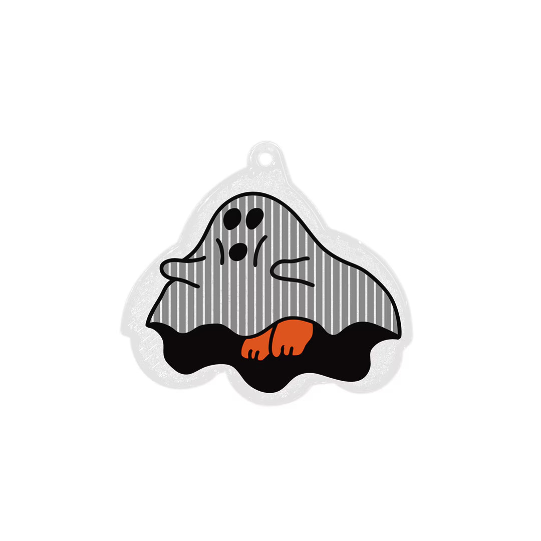 Ghost-shaped reflector keychain with striped grey sheet, black base, orange foot and hanging hole.