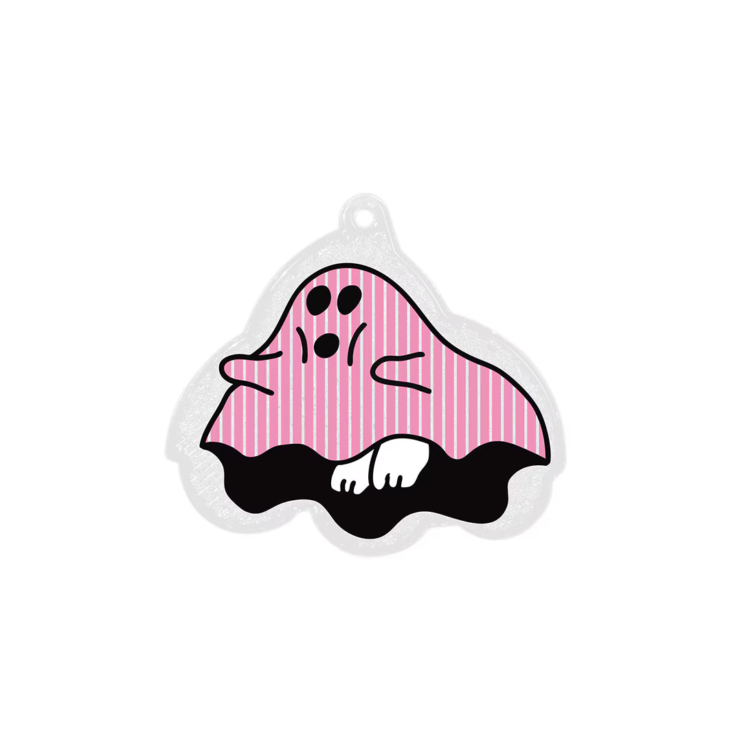 Ghost reflector keychain with pink striped sheet, black face and white paws, with hanging hole at top.