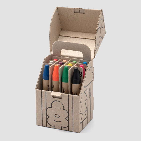 Woset Doona's Magic Crayons standing in an open kraft cardboard box printed with simple line drawings.