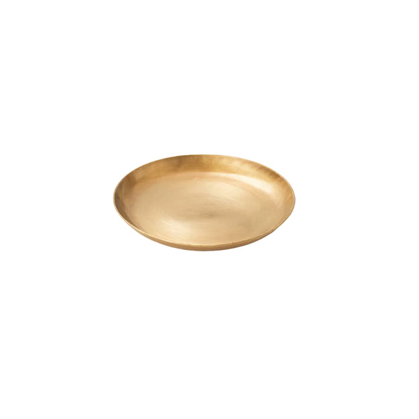 Small round brass plate with shallow curved sides and a warm hand-finished sheen, shown at an angle.