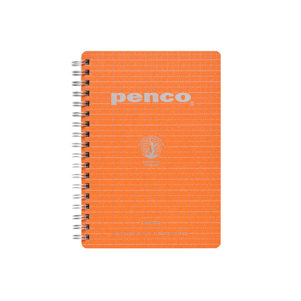 Penco wirebound B6 notebook in Orange with silver grid pattern and logo on the cover, twin-wire spiral binding.