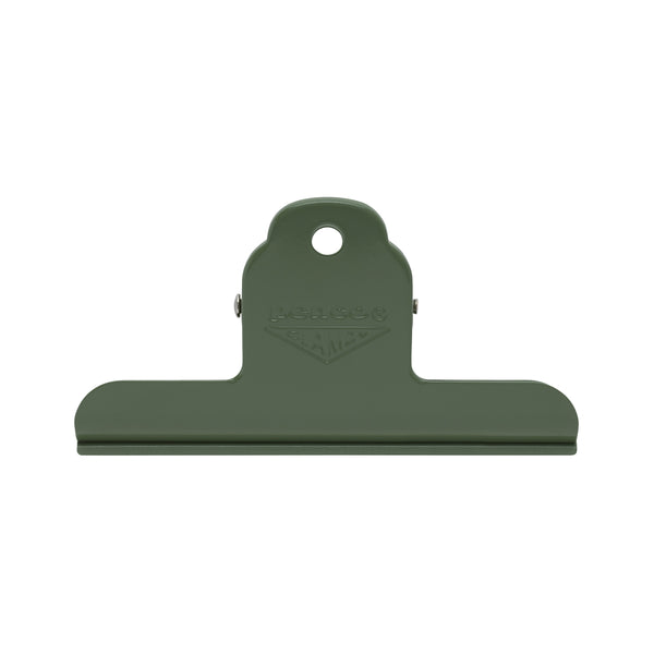 Penco Clampy Clip Metal M in Green, a steel bulldog clip with hanging hole and embossed logo