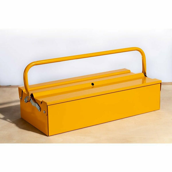 Closed Yellow steel tool box with folding carry handle and metal latch, on a wooden surface.