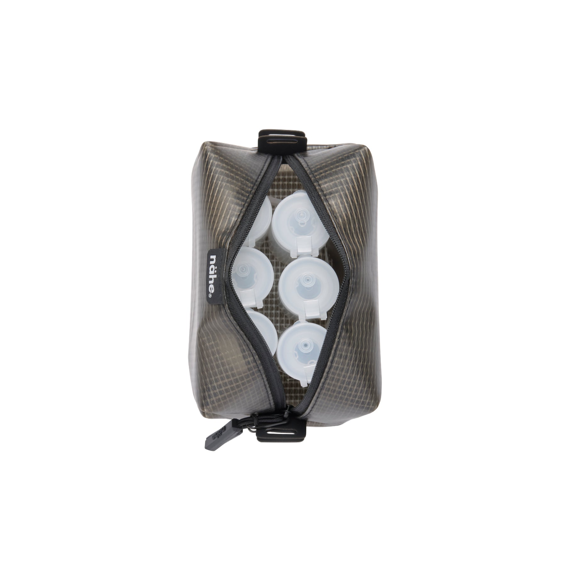 Nähe Gray semi-transparent grid pouch, unzipped to show white pump bottles packed inside.