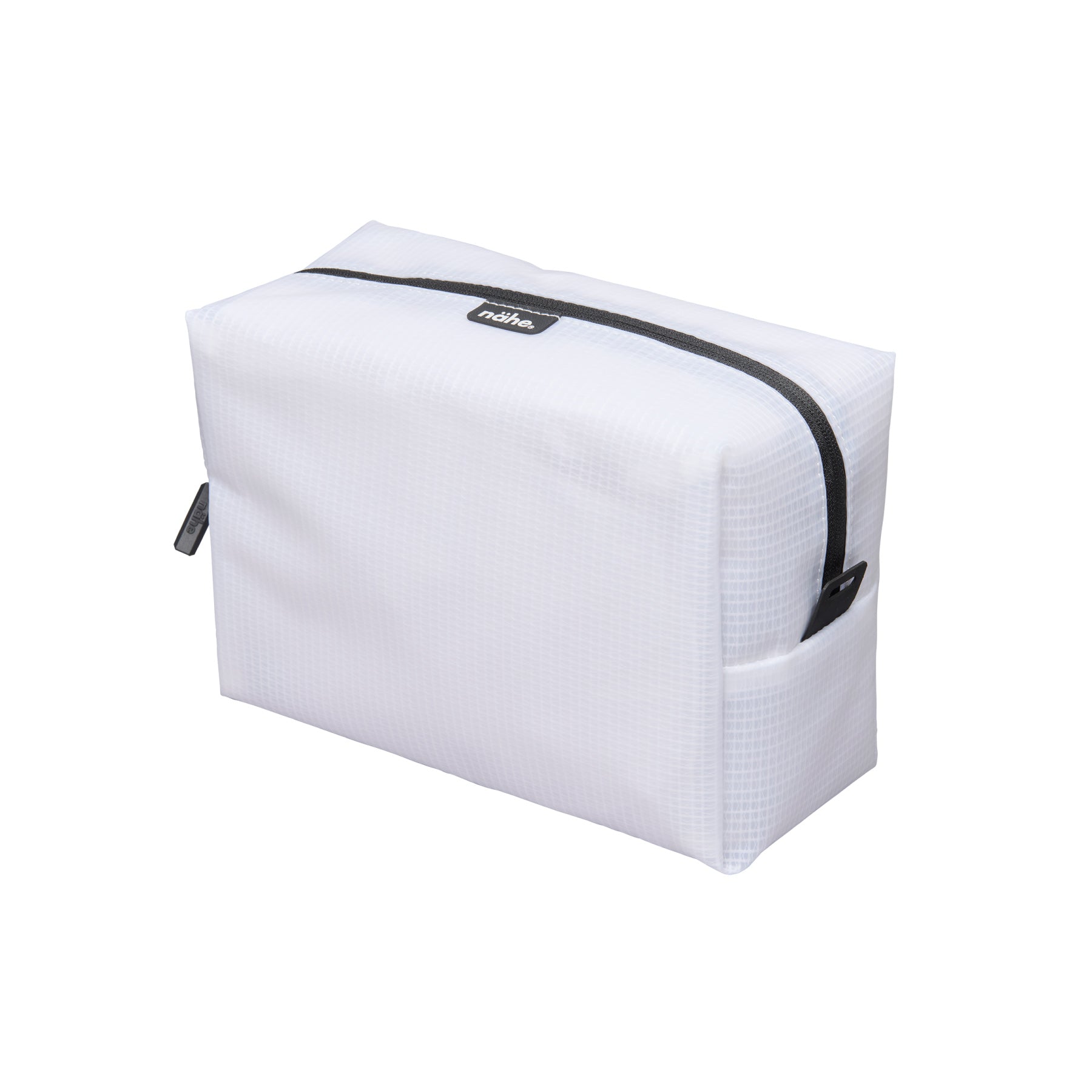 Nähe Soft Grid Pouch in Clear, a boxy grid-textured zip pouch with black zipper and side slip pocket.