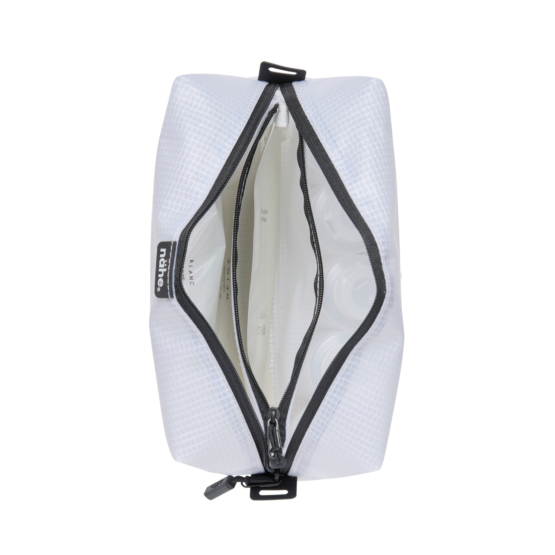 Nähe Soft Grid Pouch in Clear, unzipped to show the interior with a zippered internal divider.