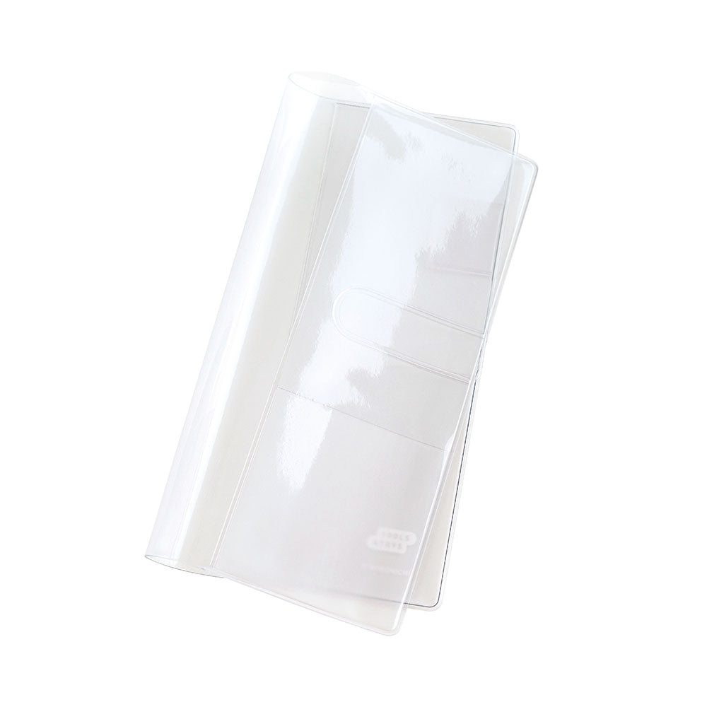 Clear plastic Hobonichi Techo Weeks cover, folded open to show inner pockets and small logo