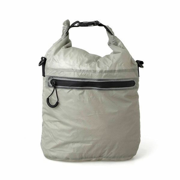 Nähe Light Gray ripstop nylon dry bag with roll-top buckle closure and black front zip pocket.