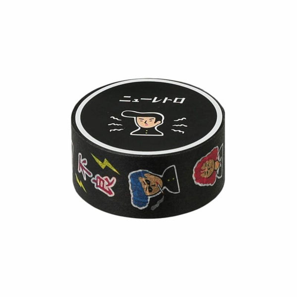 Roll of black washi tape printed with retro Japanese illustrations, a face and text on the top label.
