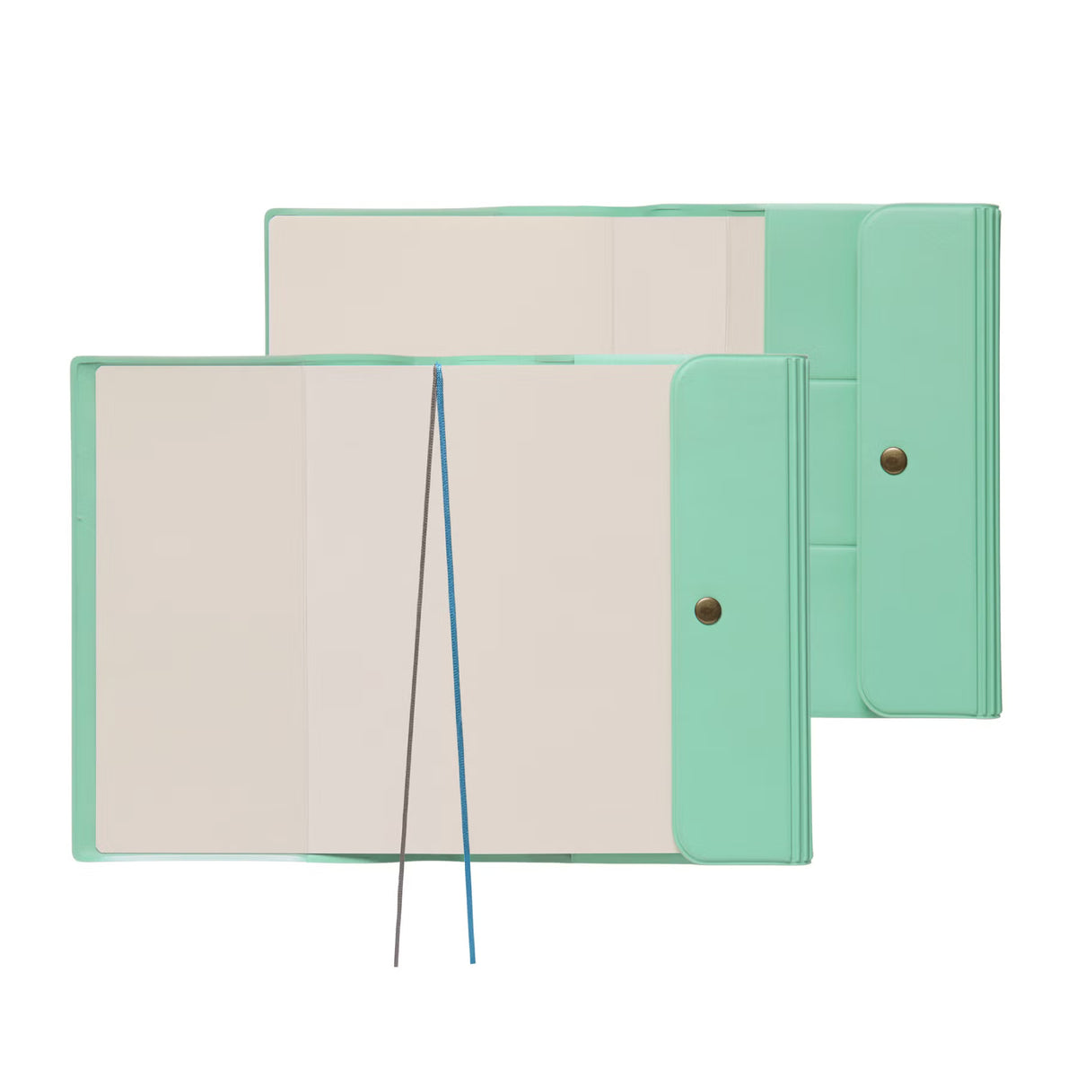 Two Mint Nähe B6 planners lying open, showing blank pages, two ribbon markers and snap-button flaps.