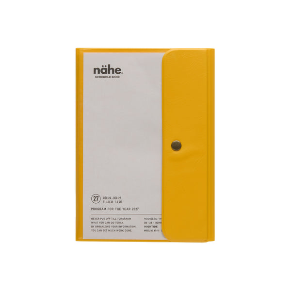 Nähe B6 weekly planner in Yellow with clear cover, snap-button flap and schedule book title page.