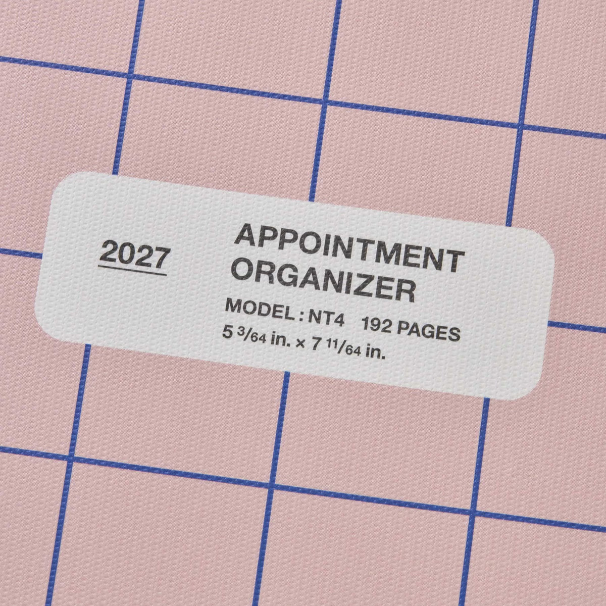 Close-up of white label on Pink checked planner cover reading 2027 Appointment Organizer, 192 pages.