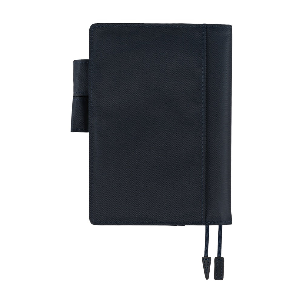 Hobonichi A6 Original book cover in Navy, closed, with pen loop and dark elastic closure cords.