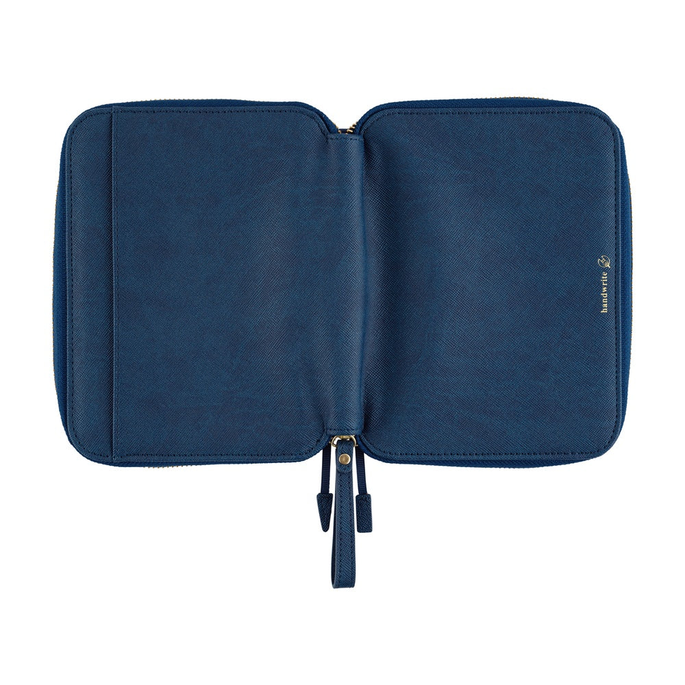 Hobonichi A6 planner cover in Lago blue, opened flat to show the textured interior and zip pulls.