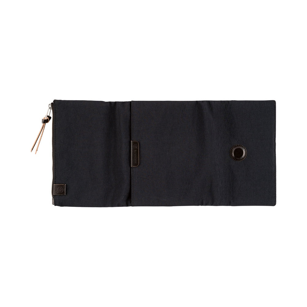 Hobonichi A6 Tragen book cover in Black, laid open flat with zippered pocket, leather pull and metal eyelet