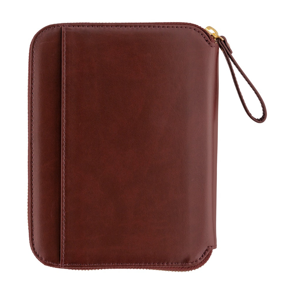 Hobonichi A6 zip-around planner cover in Amarone leather with gold zipper pull and wrist strap