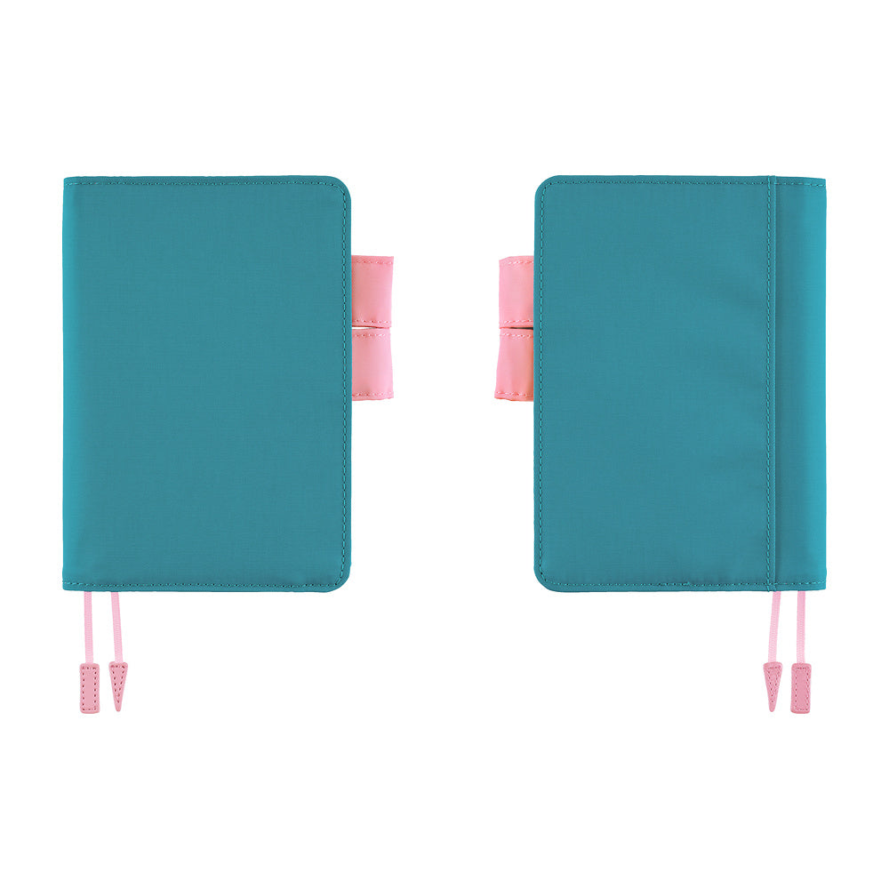 Hobonichi A6 book cover in teal shown from front and back, with pink pen loop and bookmark tassels.