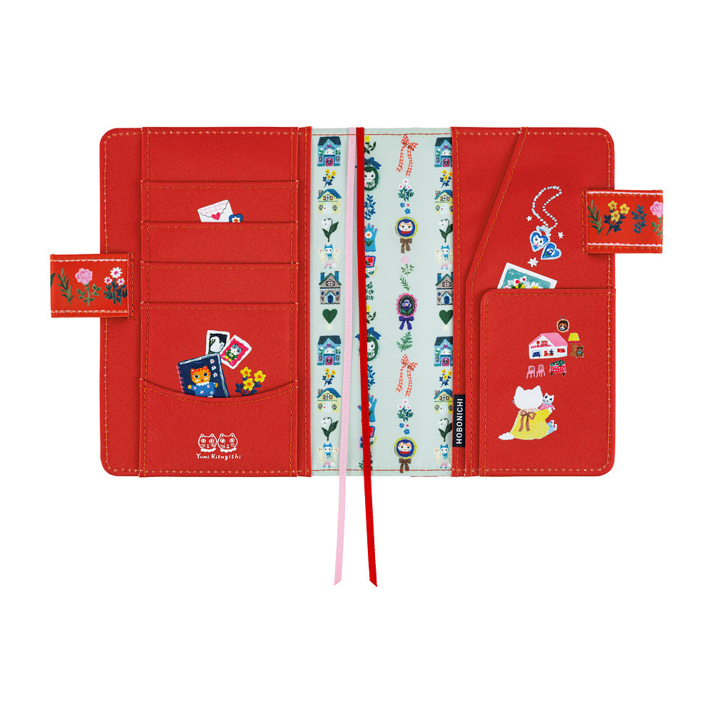 Open Red Hobonichi A6 book cover showing card pockets, illustrated inner lining and two ribbon bookmarks