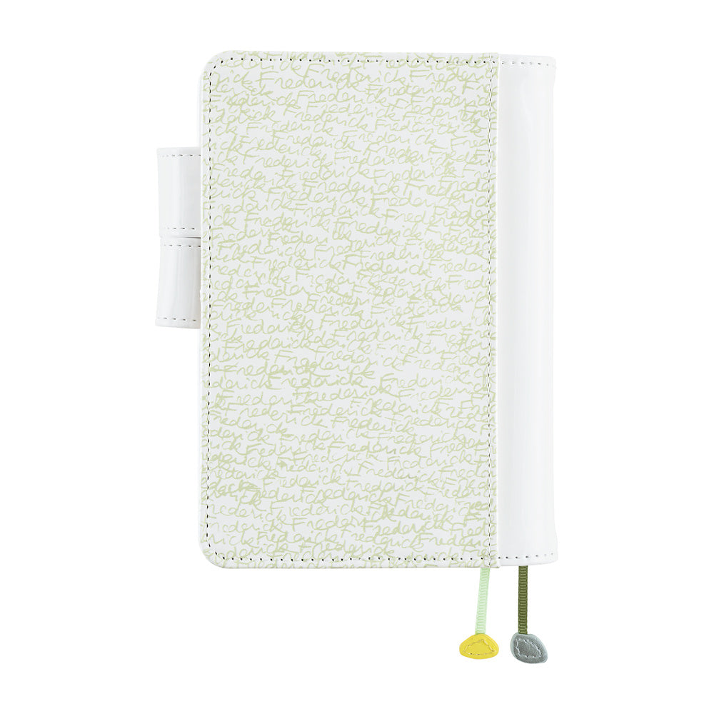 White A6 planner cover with pale handwritten script pattern, pen loop, and two ribbon bookmarks with charms.