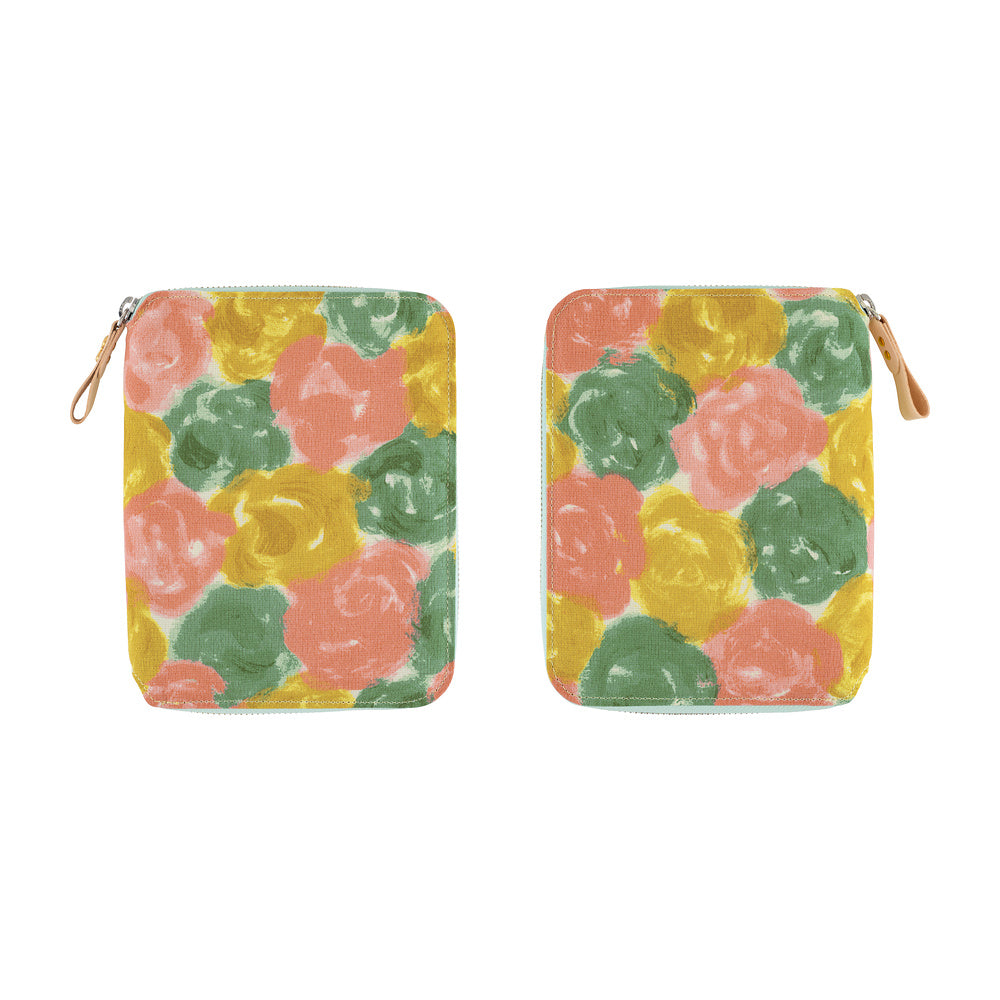 Front and back views of a Hobonichi A6 book cover in Pink Multi floral fabric with leather zipper pull.