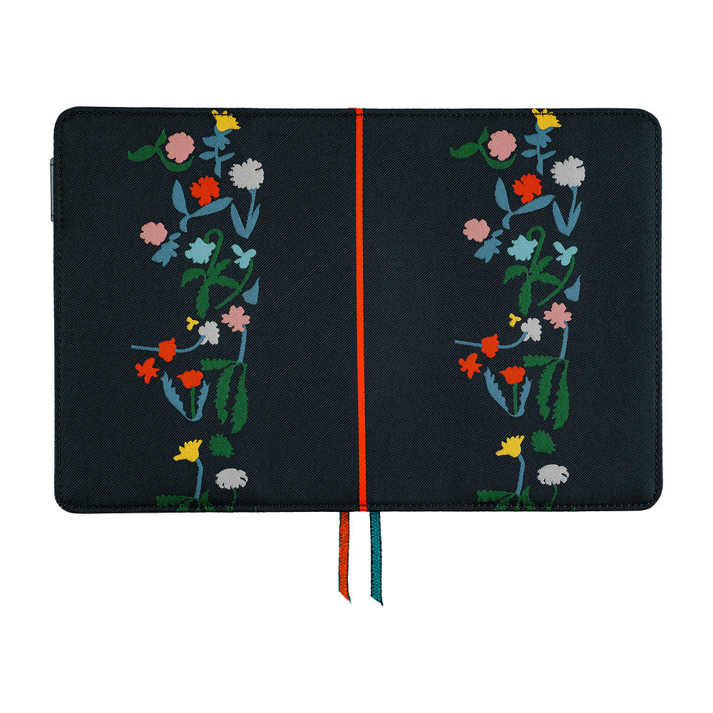 Navy A6 book cover opened flat, colorful embroidered flower designs on both sides, with orange and teal bookmarks.