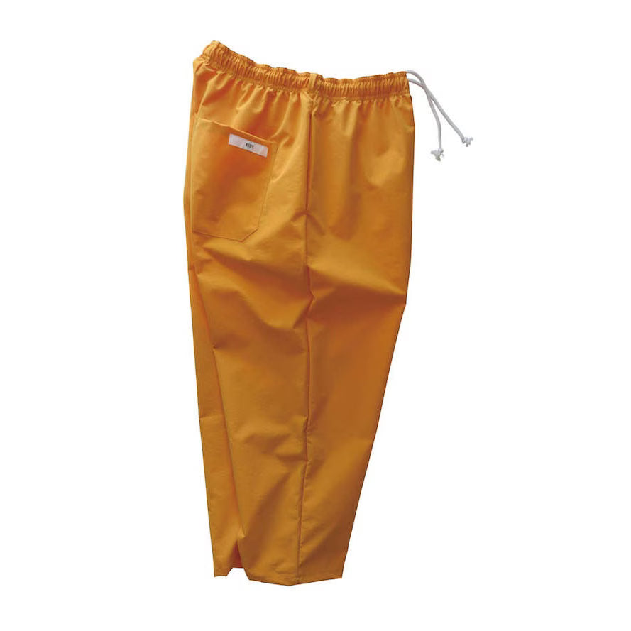 Voiry Sunday Pants in Orange, side view showing elastic drawstring waist and back patch pocket