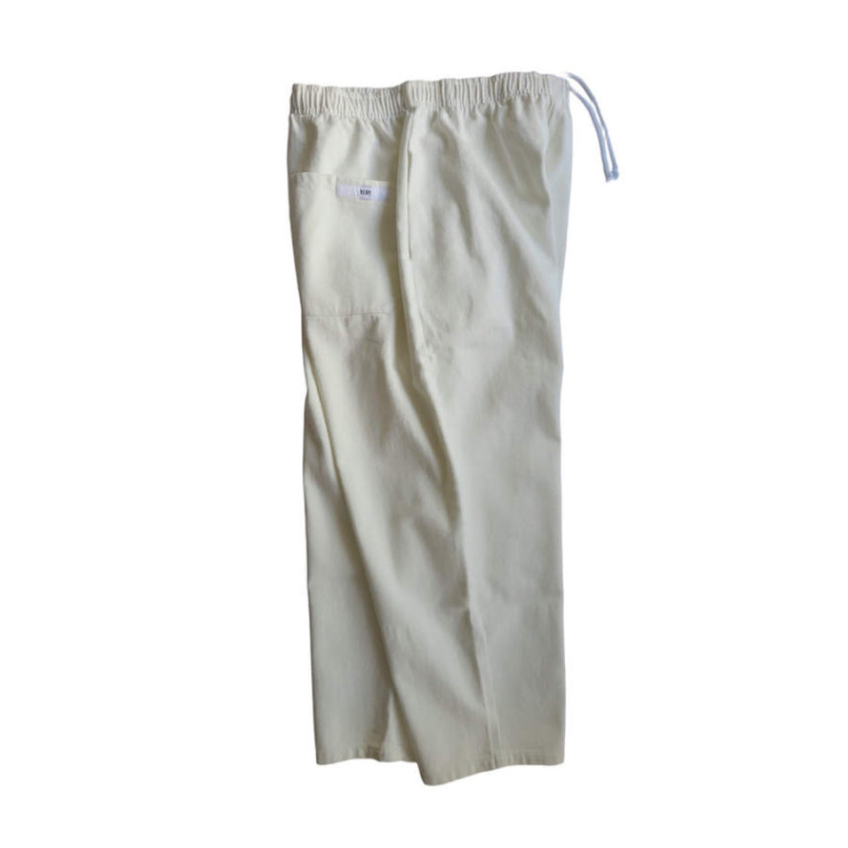Voiry Sunday Pants in White Denim, laid flat from the back with elastic waist, drawstring and back pocket.
