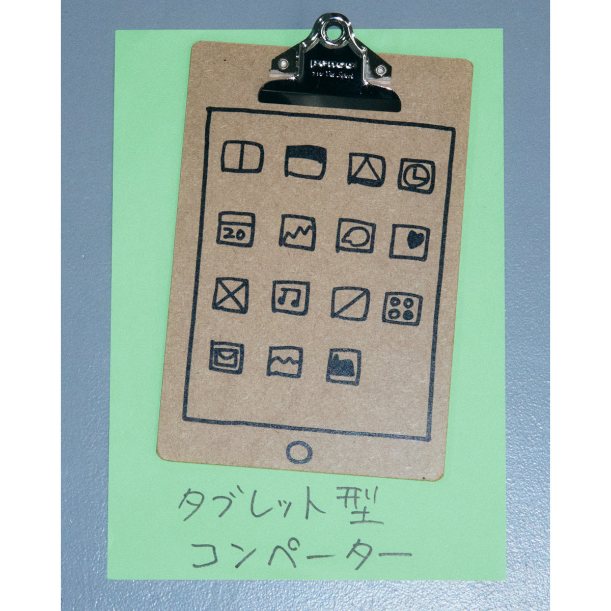 Penco A5 kraft clipboard with silver clip, printed with Ken Kagami's tablet drawing, on green paper