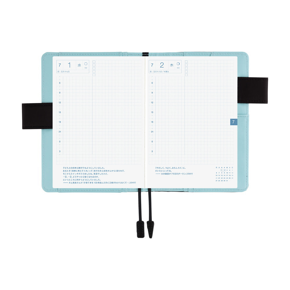 Hobonichi A6 book cover in Blue Parasol, open flat to show grid daily pages and black bookmark cords