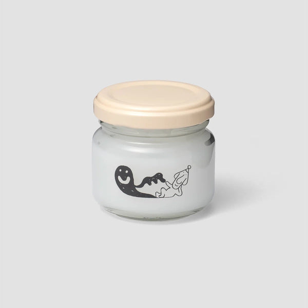 Glass jar of Woset glue with cream lid and black character illustration on the front.