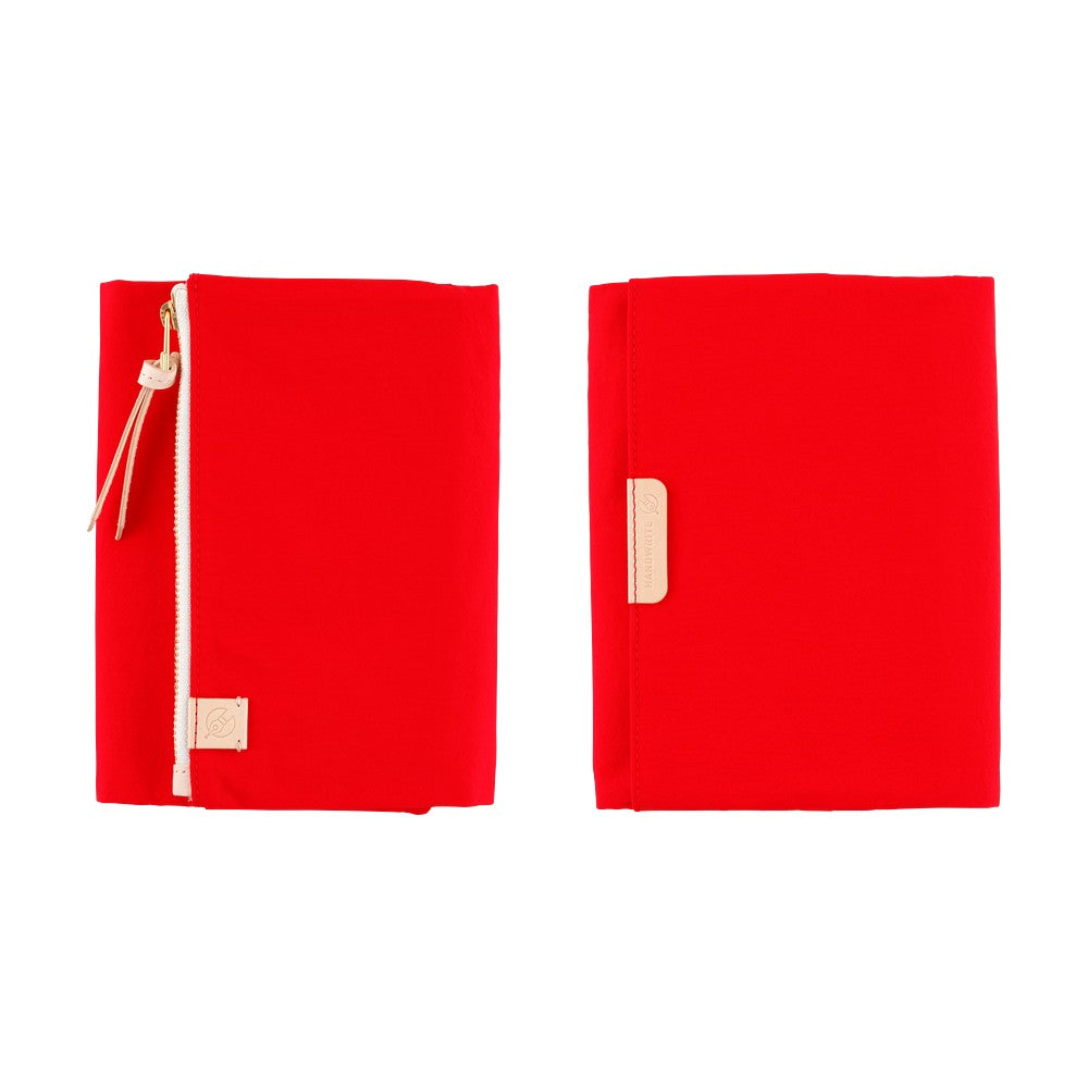 Red Hobonichi A6 Tragen book cover shown front and back, with pale zipper pull and leather tabs.