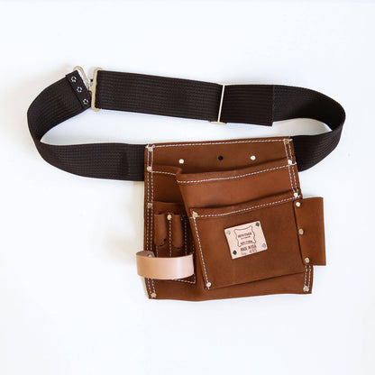 A 5 pocket quality brown suede leather tooolbag with dark brown waist belt