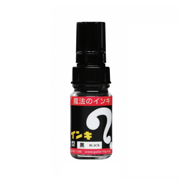 Small glass bottle of Magic Ink permanent marker ink in black, with a black cap and red and black label.