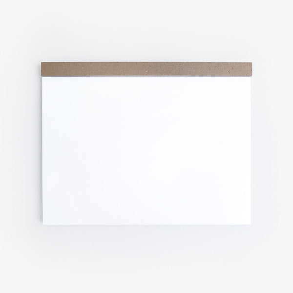 Ito Bindery A4 drawing pad with blank white pages bound along the top edge with a Kraft cardboard strip.