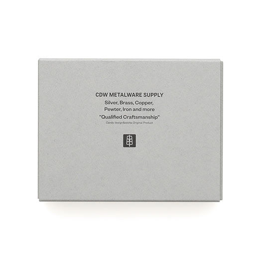 Grey paper gift box printed with "CDW Metalware Supply" text and a small black logo emblem.