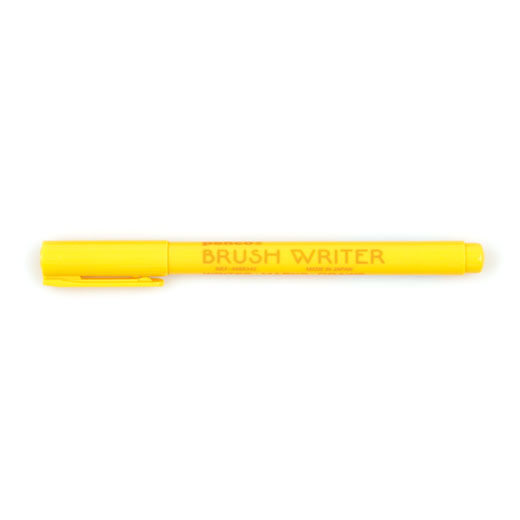 Penco Brush Writer Pen in Yellow, capped and shown horizontally with brand text along the barrel.
